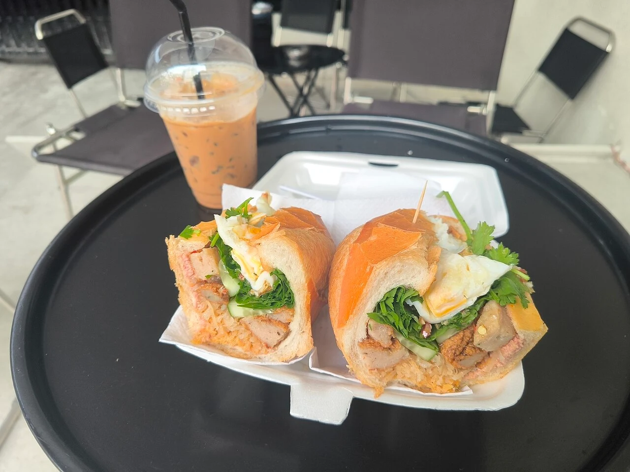 Bánh mì and iced Vietnamese coffee, photographed in Saigon