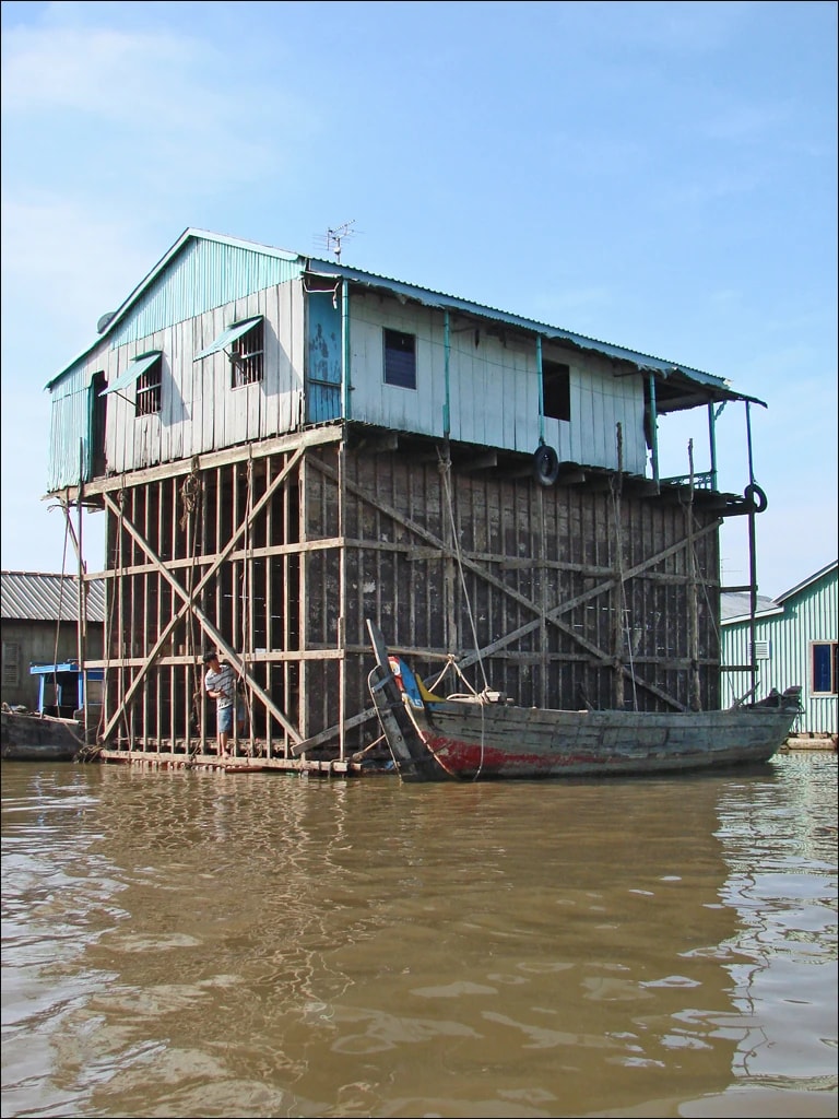 Timber framing under a floating house being repaired near Chau Doc, An Giang. This photograph is illustrative and is not from Lan Ha Bay.