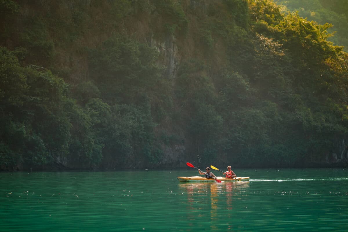 Two-person kayak on Lan Ha Bay at golden hour