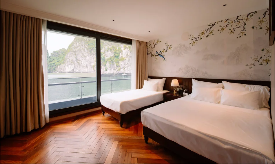 Family Cabin with a double bed and a single bed beside the balcony doors